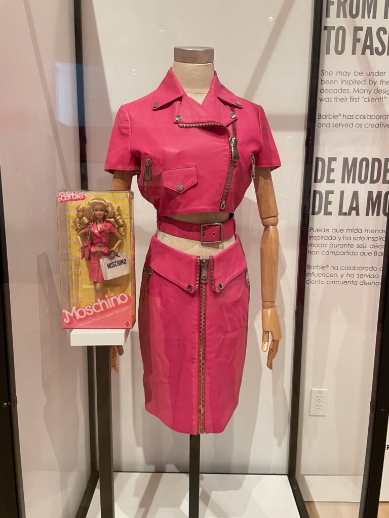 Moschino Barbie, 2013, next to Barbie-inspired Moschino Spring 2015 Read-to-Wear Collection, Phoenix Art Museum/Photo: P. Burke