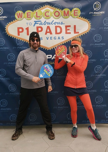 Stacey Gualandi in orange tracksuit with husband at P1 Padel in Las Vegas/Photo: Stacey Gualandi